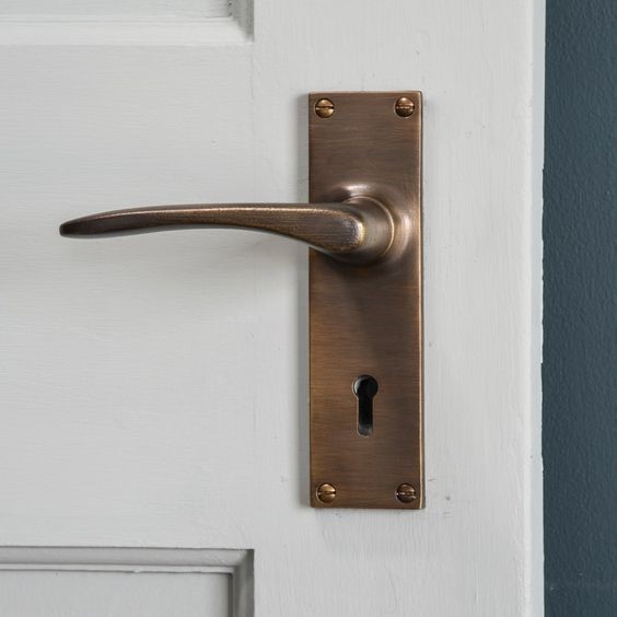 Wooden door handle design with a lever on a backplate