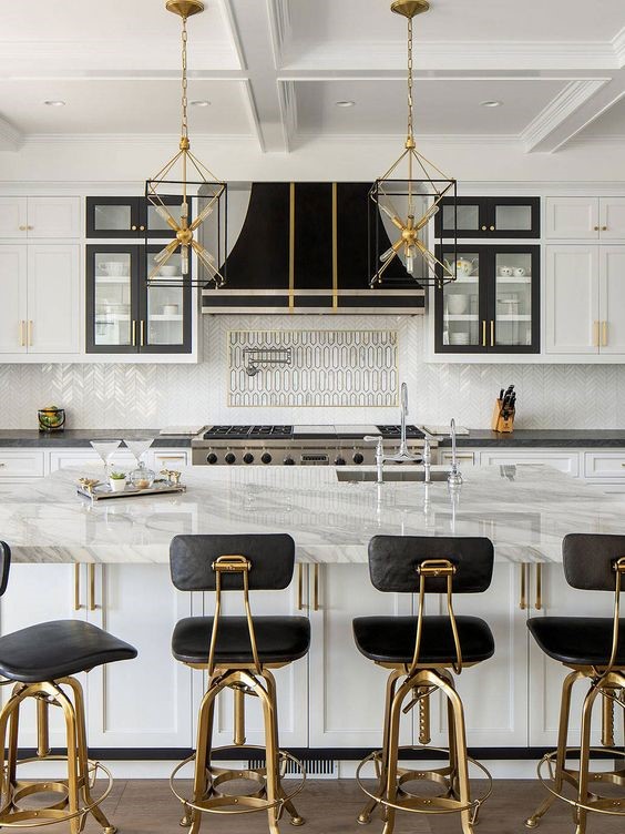 Use of warm metallics in black and white modular kitchen