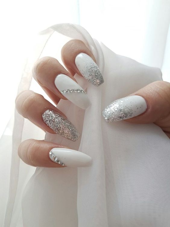 white nails with diamonds on them